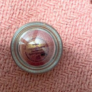 Tarte chrome powder eyeshadow pot.